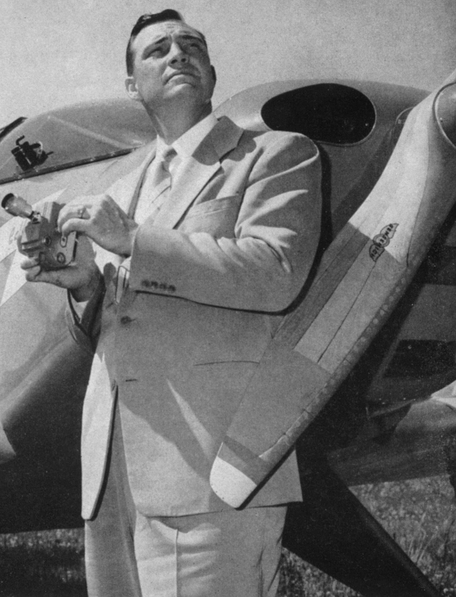 Kenneth Arnold beside his private aircraft shortly after his June 24, 1947 sighting over Mount Rainier that gave the world the term 'flying saucer.'
